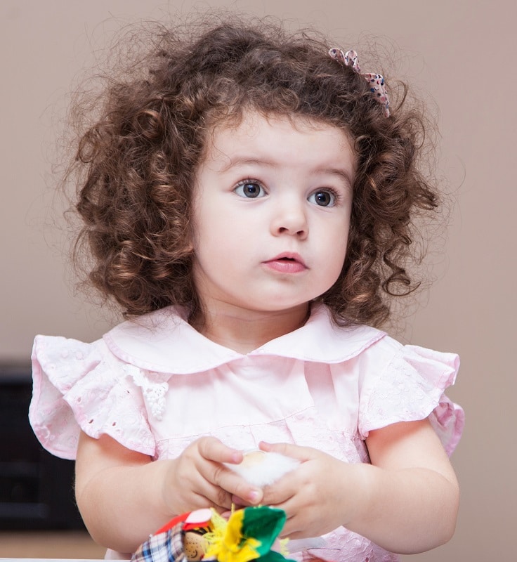 toddler girl with thick curly hair