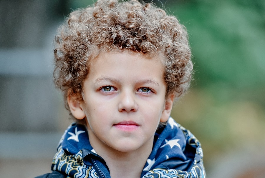 little boy with curly brown hair