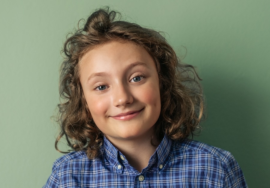 little boy with long curly hair