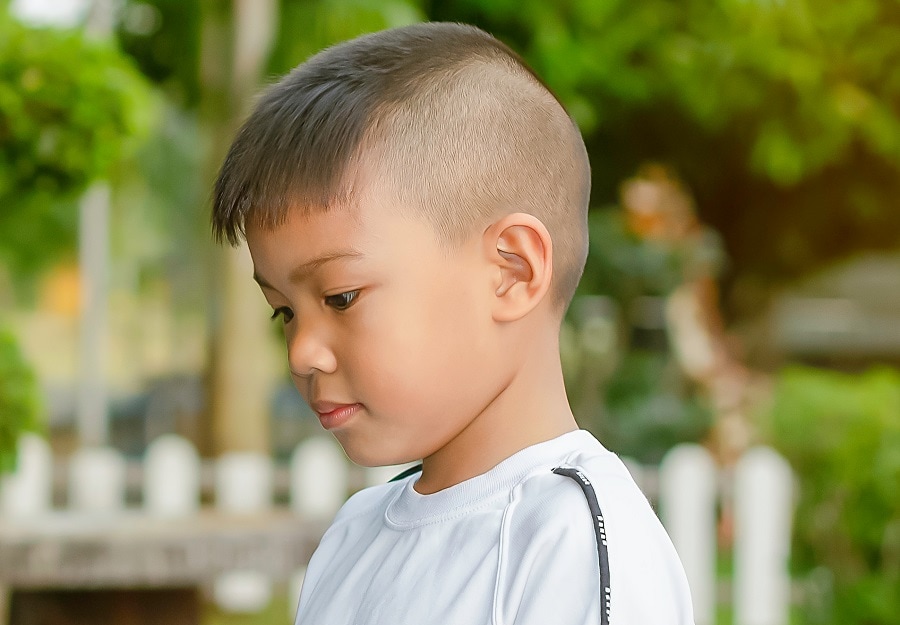 7 year old boy with shaved hairstyle