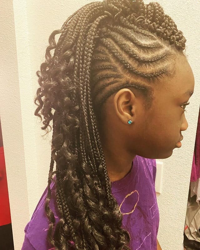 kid with curly mohawk braids