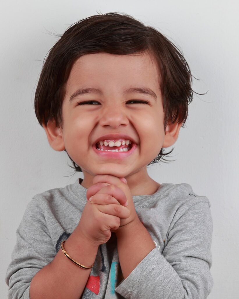 Indian baby boy hairstyle with side part