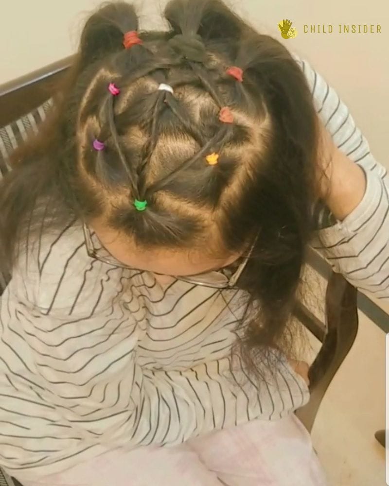 Boldly designed rubber band hairstyle